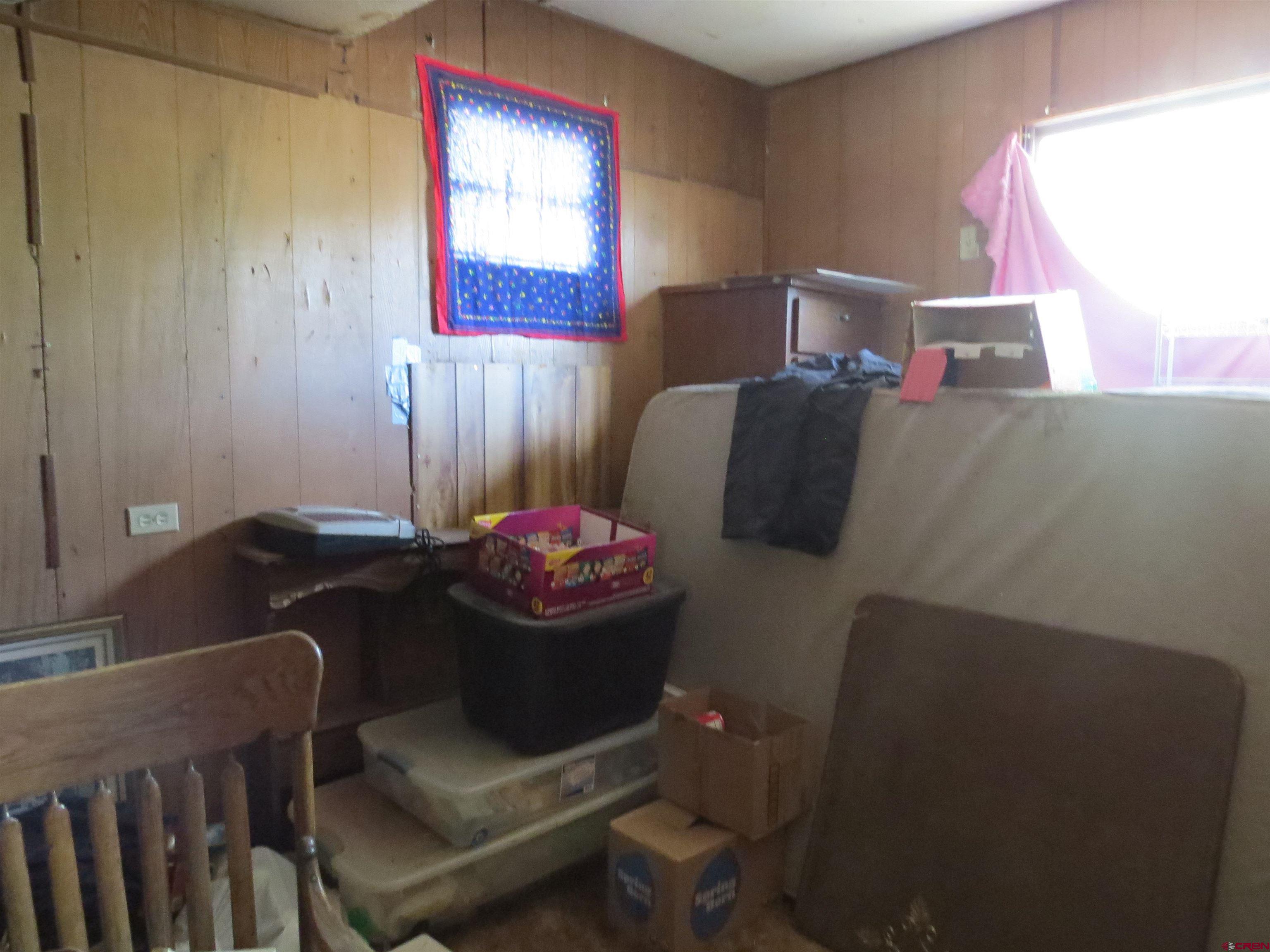 22203 Canal Street Austin, CO 81410 - Photo 6 of 20 a living room with furniture and a window