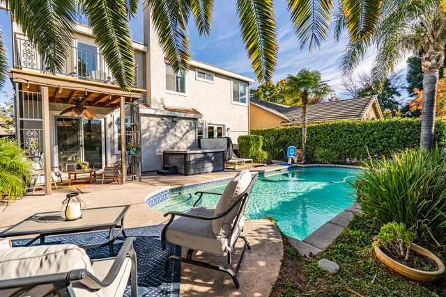 a view of a swimming pool with a patio