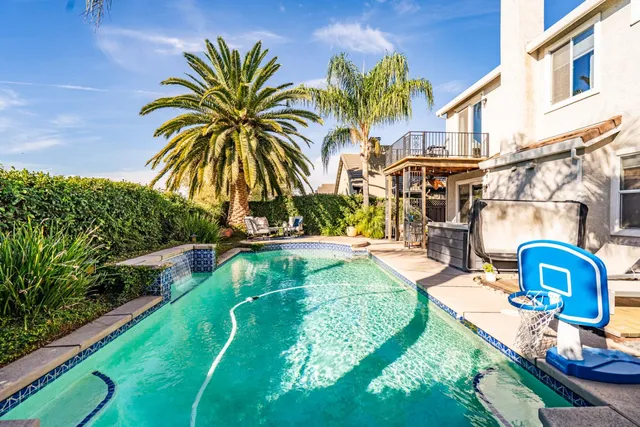 a view of swimming pool with a patio