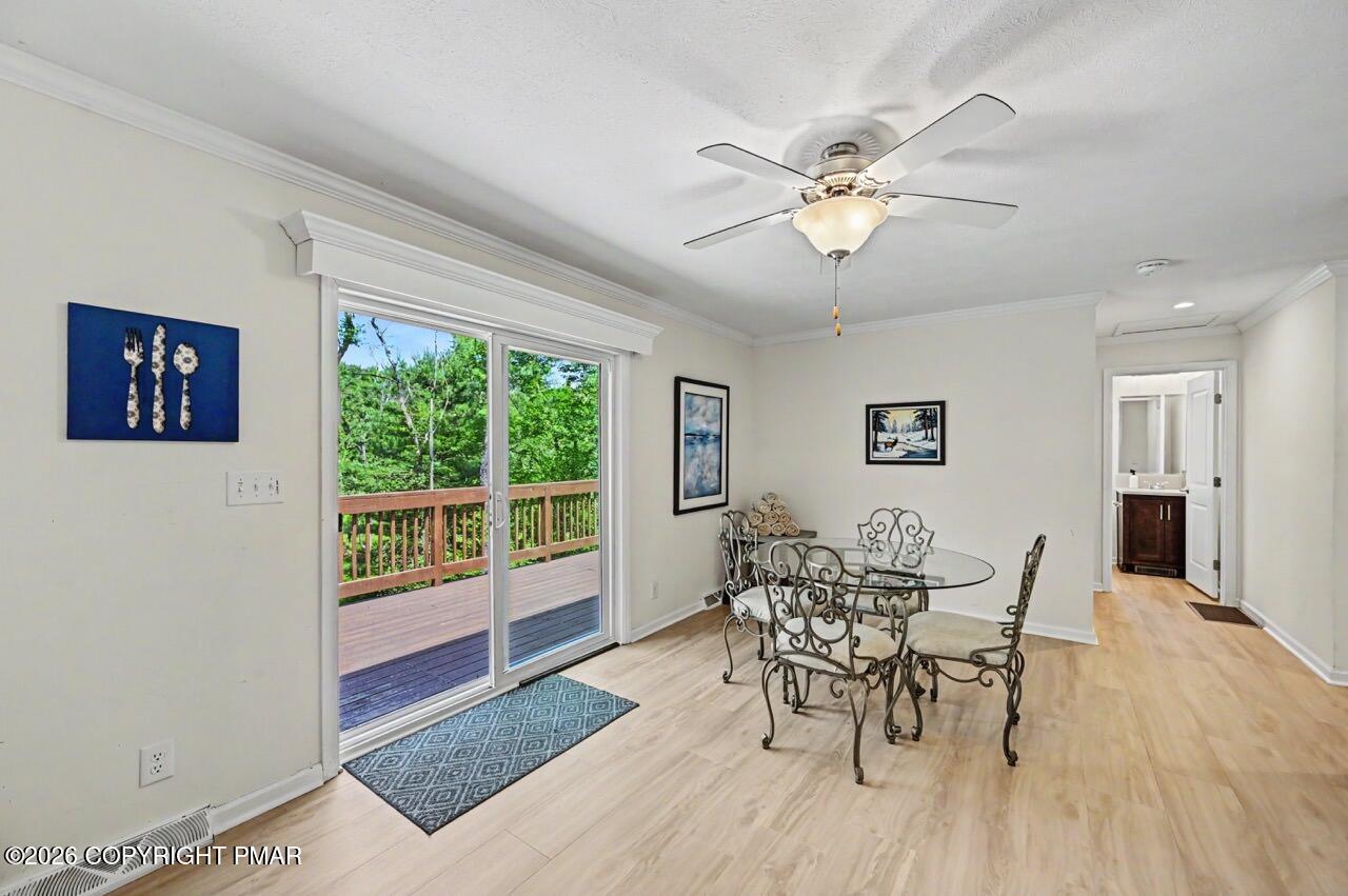 2016 Locust Ridge Road Pocono Lake, PA 18347 - Photo 28 of 82 a view of a dining room with furniture window and wooden floor