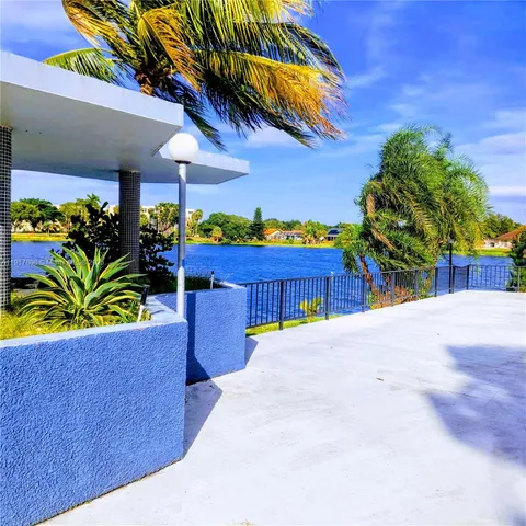 a view of a house with a garden and pathway