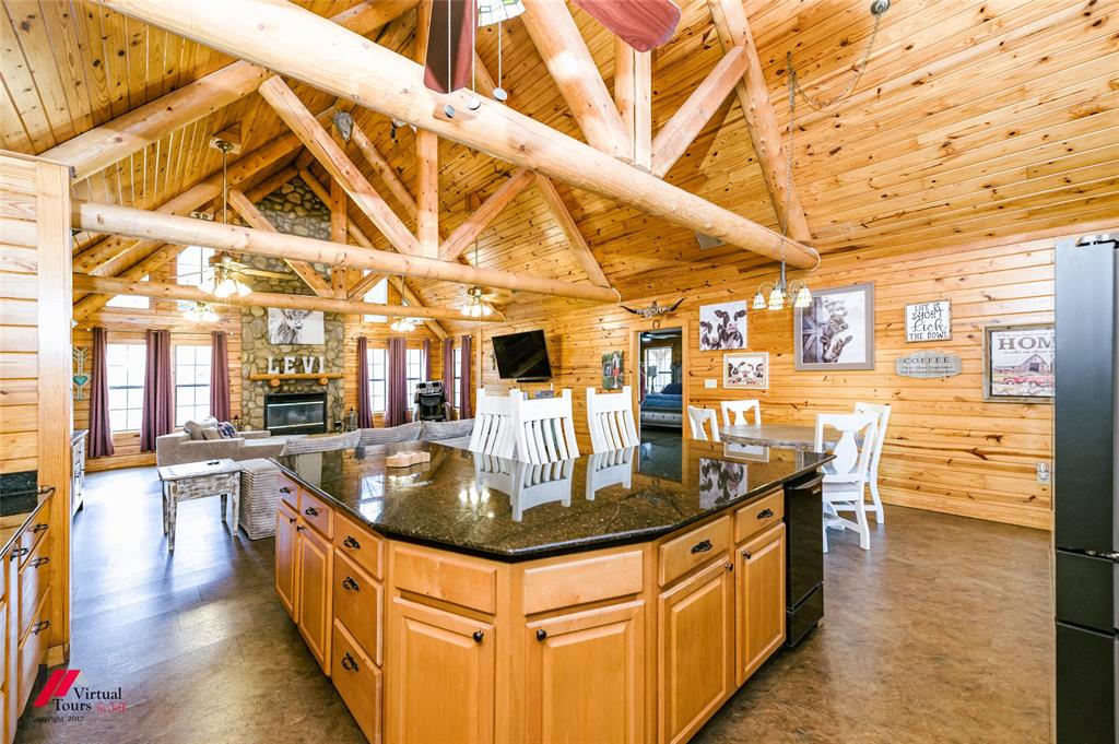 550 Middleton Road Stonewall, LA 71078 - Photo 12 of 40 a kitchen with stainless steel appliances granite countertop a sink and wooden cabinets