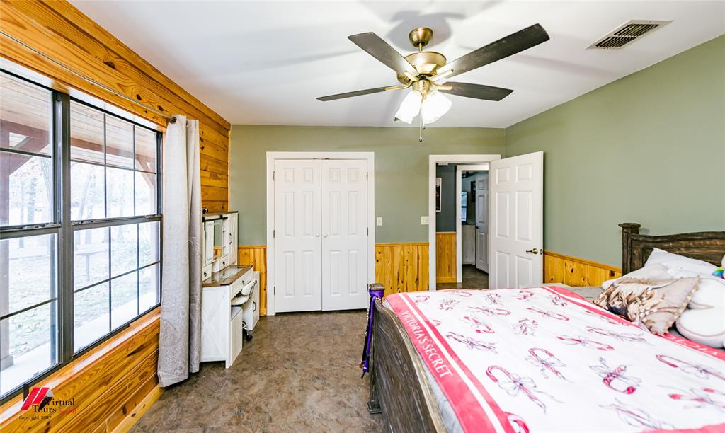 550 Middleton Road Stonewall, LA 71078 - Photo 30 of 40 a bed room with a bed and a television