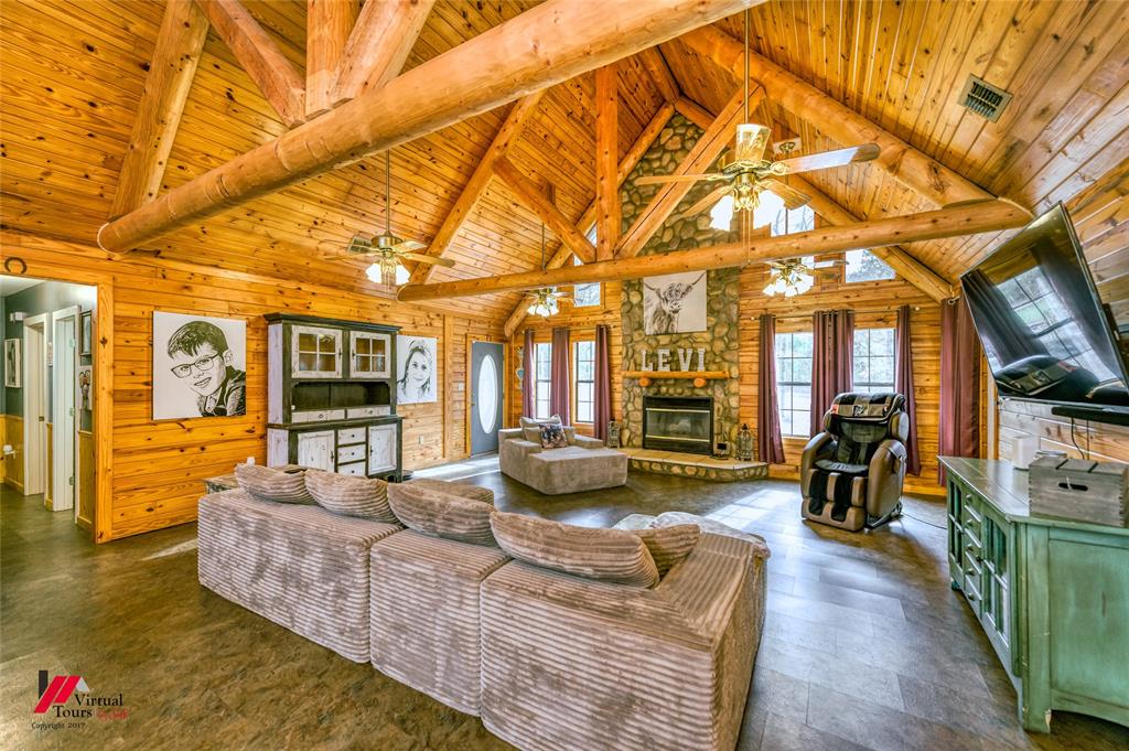 550 Middleton Road Stonewall, LA 71078 - Photo 4 of 40 a living room with fireplace furniture and a large window