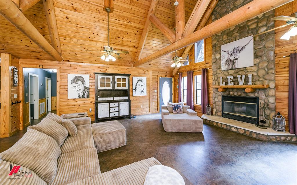 550 Middleton Road Stonewall, LA 71078 - Photo 5 of 40 a living room with furniture and a fireplace