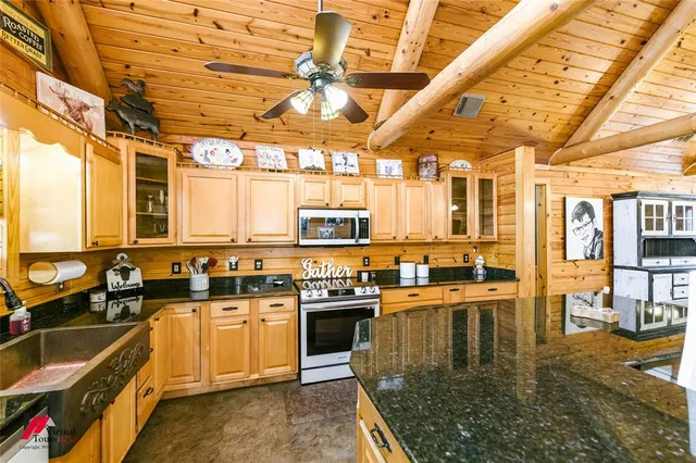 a kitchen that has a sink and a stove
