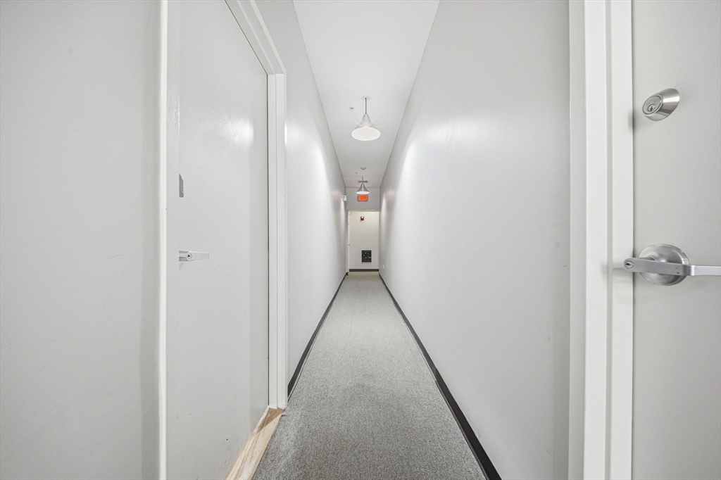 156 Chelsea Street, Unit 103 Boston, MA 02128 - Photo 11 of 27 a view of a hallway