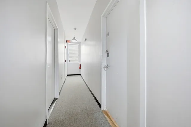 a view of hallway with white walls