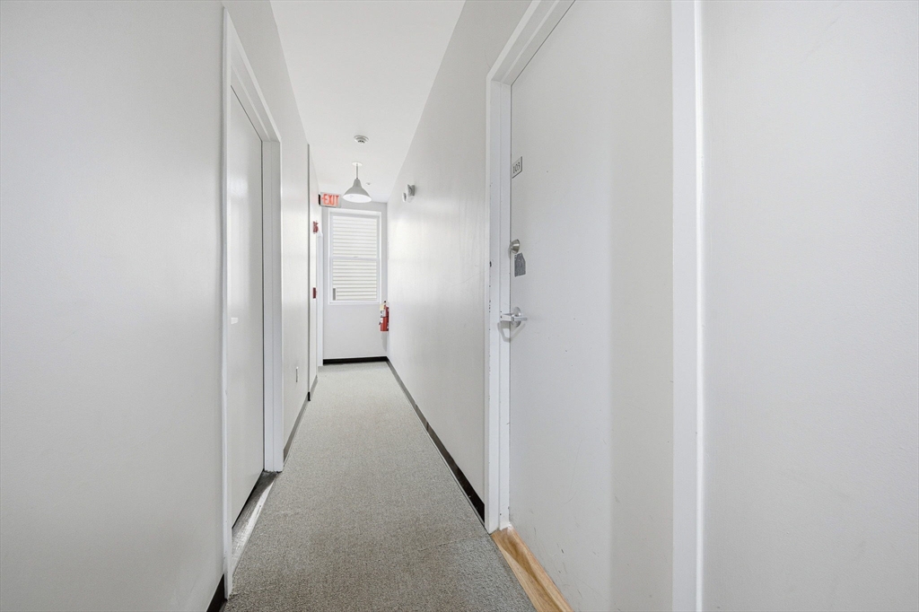 156 Chelsea Street, Unit 103 Boston, MA 02128 - Photo 12 of 27 a view of hallway with white walls