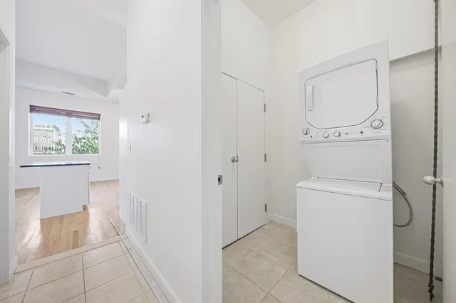 a bathroom with a granite countertop sink a toilet and a shower