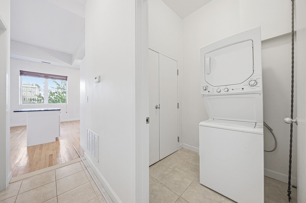 156 Chelsea Street, Unit 103 Boston, MA 02128 - Photo 18 of 27 a bathroom with a granite countertop sink a toilet and a shower