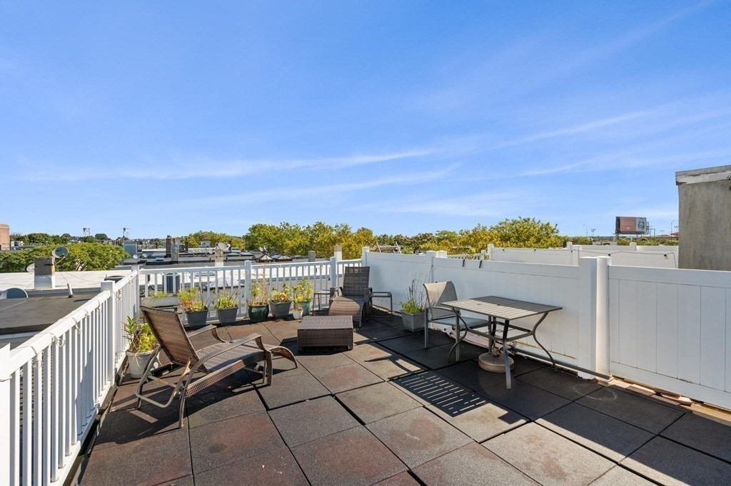 156 Chelsea Street, Unit 103 Boston, MA 02128 - Photo 19 of 27 a view of a terrace with furniture