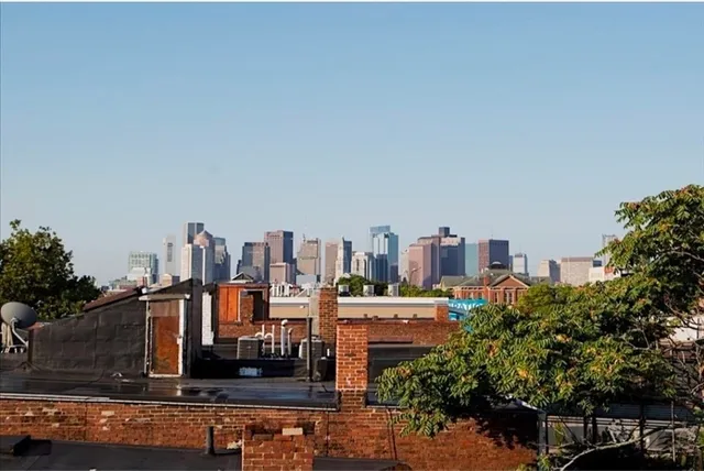 a view of a city with tall buildings