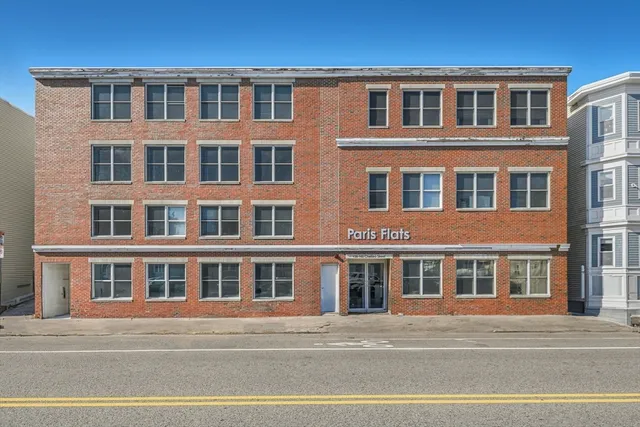 a front view of a building with a street