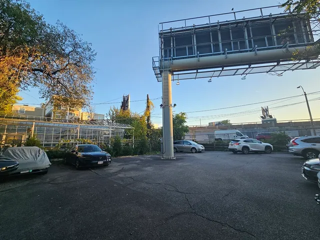 a view of parking with cars parked