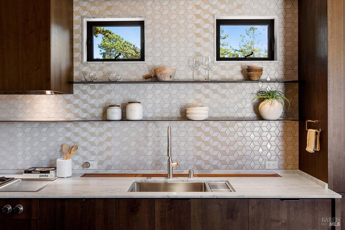 608 Seminary Drive Mill Valley, CA 94941 - Photo 18 of 67 a kitchen with a two sink and a painting on the wall
