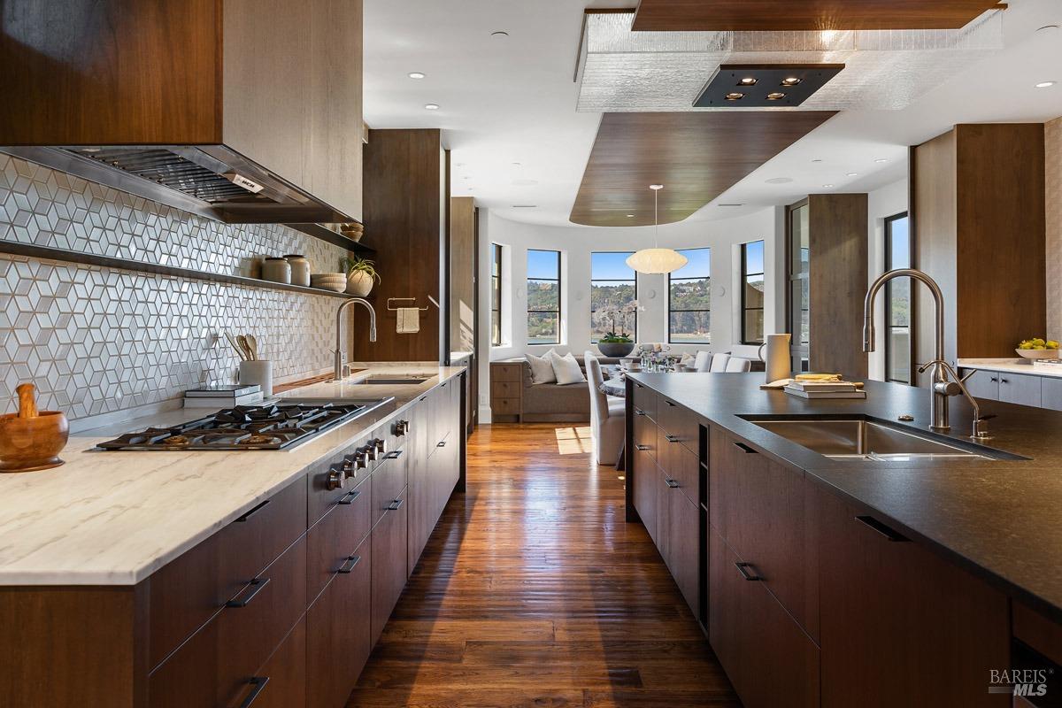 608 Seminary Drive Mill Valley, CA 94941 - Photo 22 of 67 a kitchen with stainless steel appliances granite countertop a stove a sink dishwasher and a refrigerator