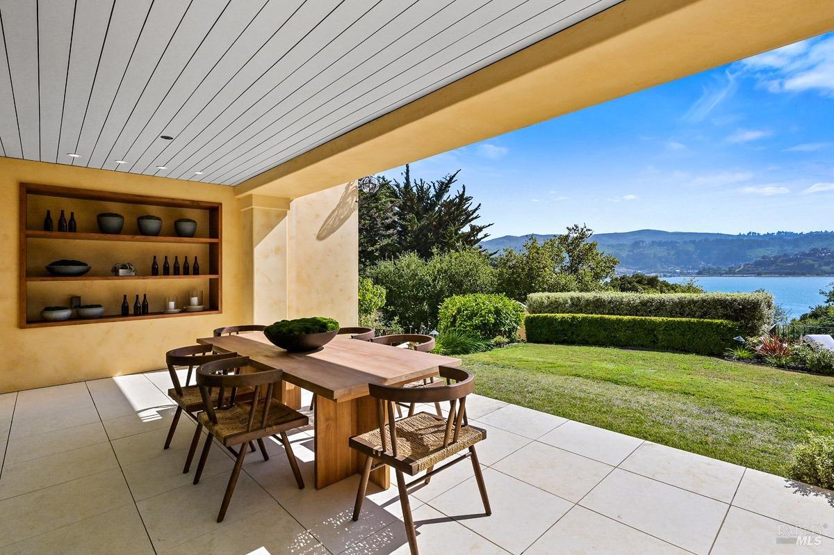 608 Seminary Drive Mill Valley, CA 94941 - Photo 28 of 67 a view of a patio with table and chairs and potted plants