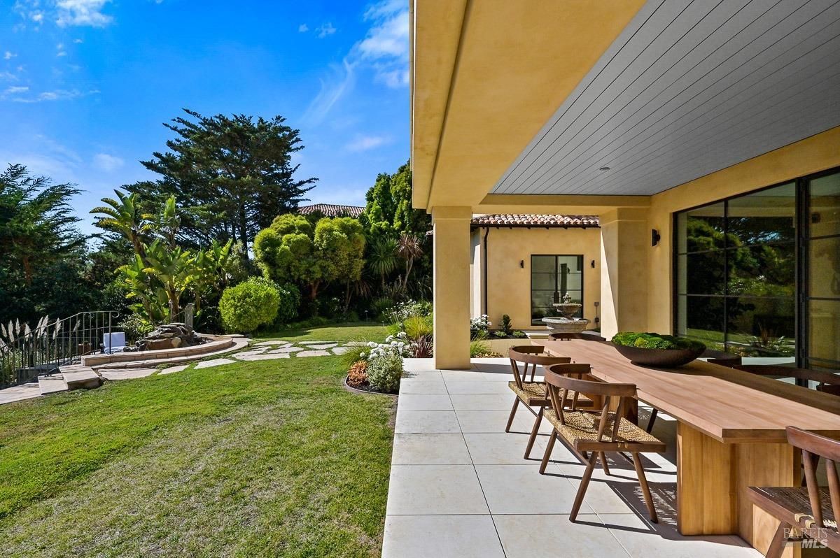608 Seminary Drive Mill Valley, CA 94941 - Photo 30 of 67 a view of a patio with couches table and chairs and potted plants