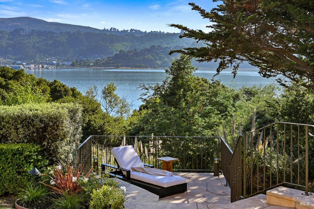 608 Seminary Drive Mill Valley, CA 94941 - Photo 33 of 67 a wooden bench sitting in the middle of a lake