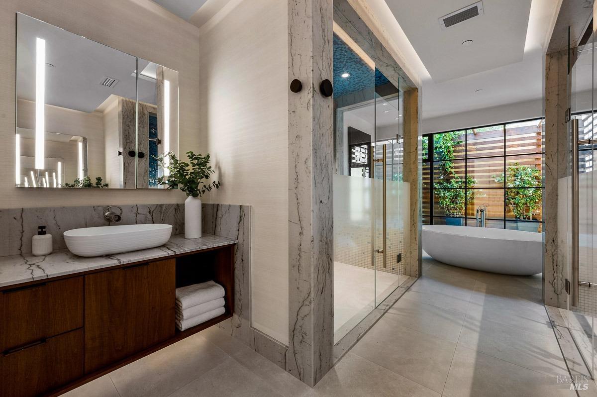 608 Seminary Drive Mill Valley, CA 94941 - Photo 38 of 67 a spacious bathroom with a tub sink and mirror