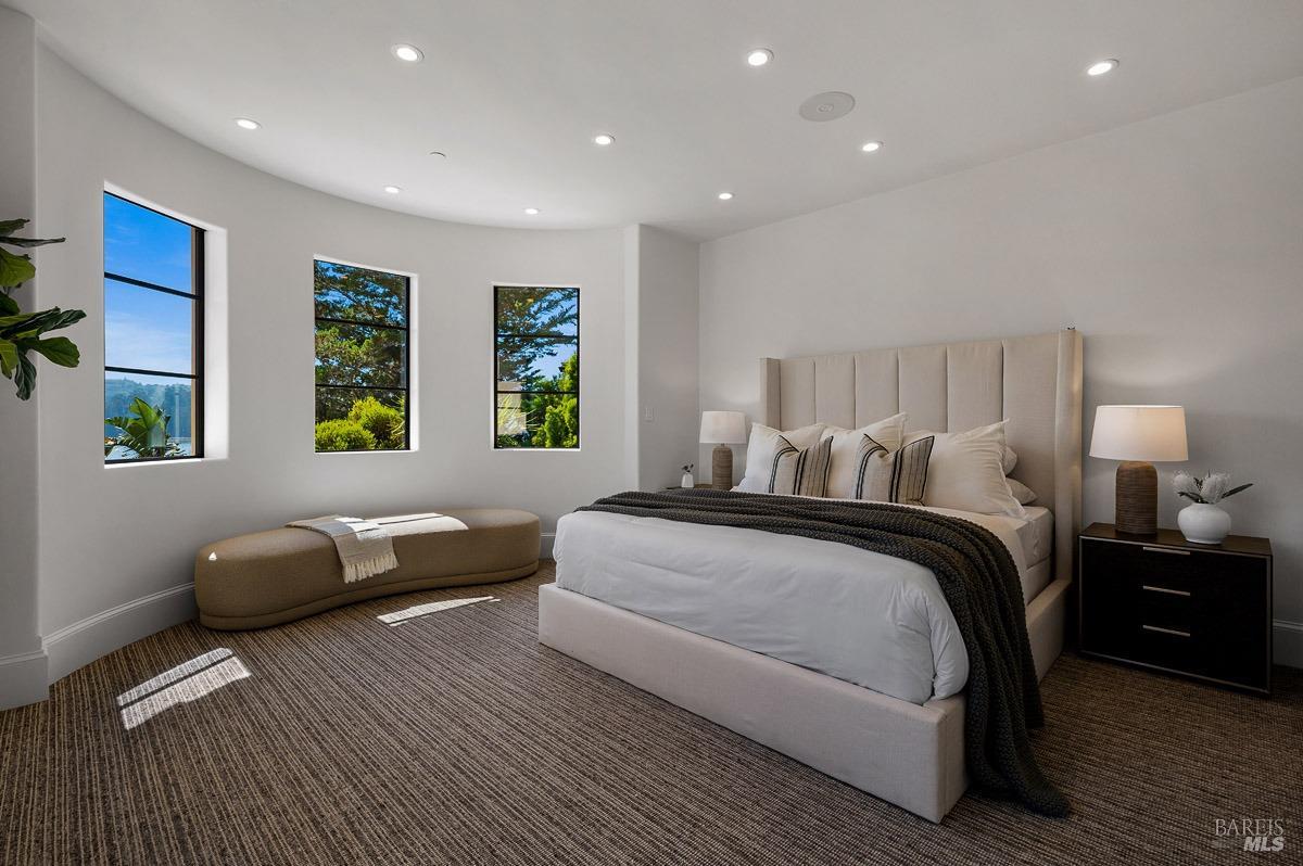 608 Seminary Drive Mill Valley, CA 94941 - Photo 44 of 67 a spacious bedroom with a bed and a couch