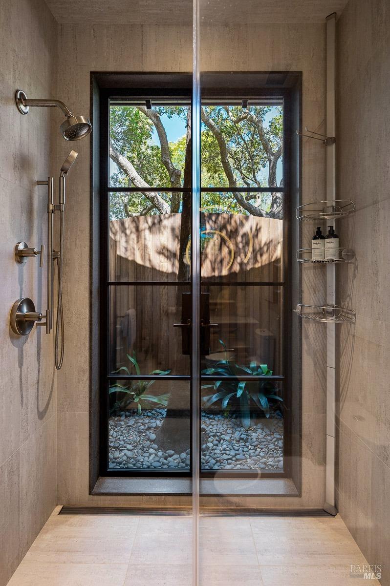 608 Seminary Drive Mill Valley, CA 94941 - Photo 49 of 67 a bathroom with a glass shower door