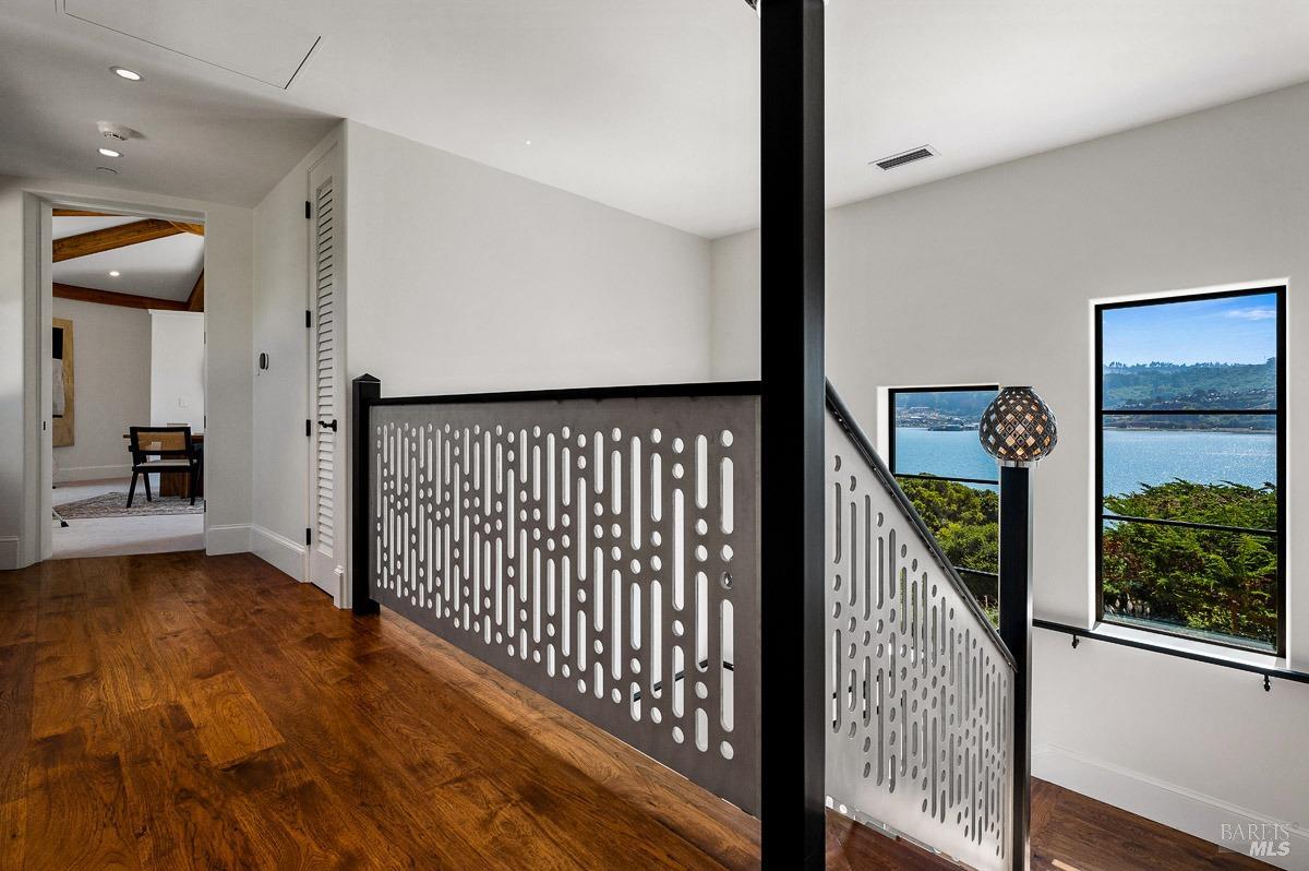 608 Seminary Drive Mill Valley, CA 94941 - Photo 53 of 67 a view of a hallway with wooden floor and staircase
