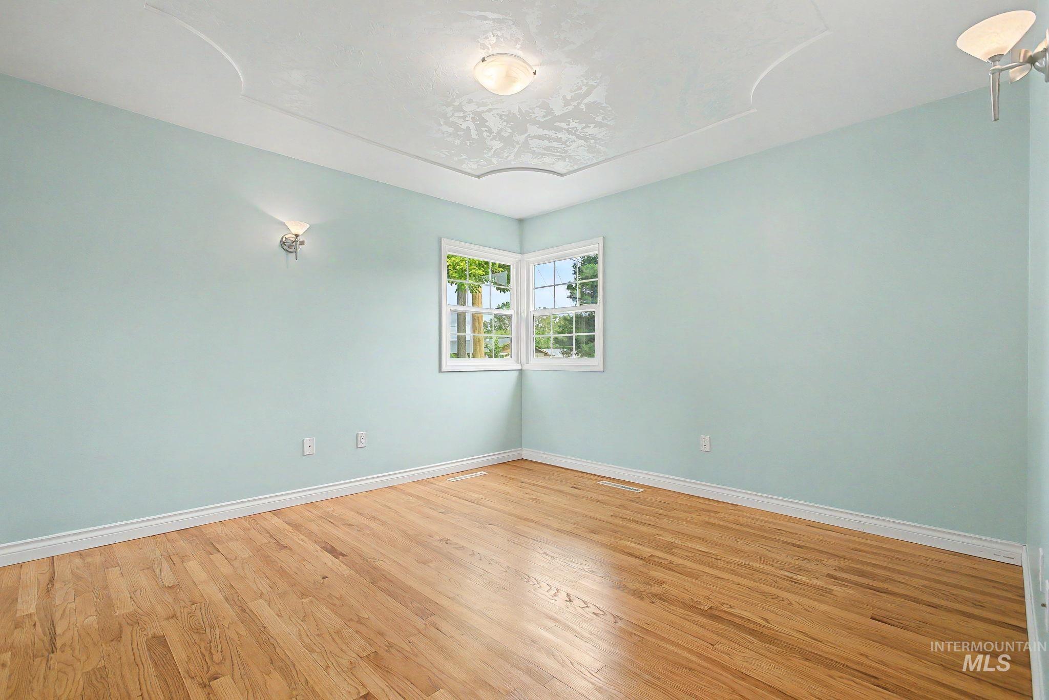 3314 6th Street Lewiston, ID 83501 - Photo 20 of 50 Light wood-finish flooring complements the pale blue walls and white trim