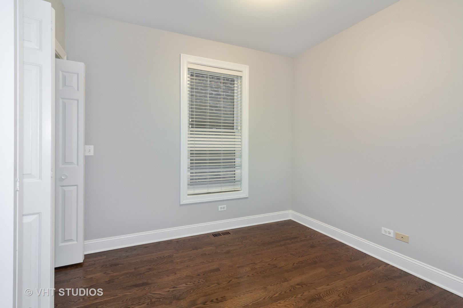 1345 West Fillmore Street, Unit 1 Chicago, IL 60607 - Photo 16 of 26 a view of an empty room with wooden floor and a window