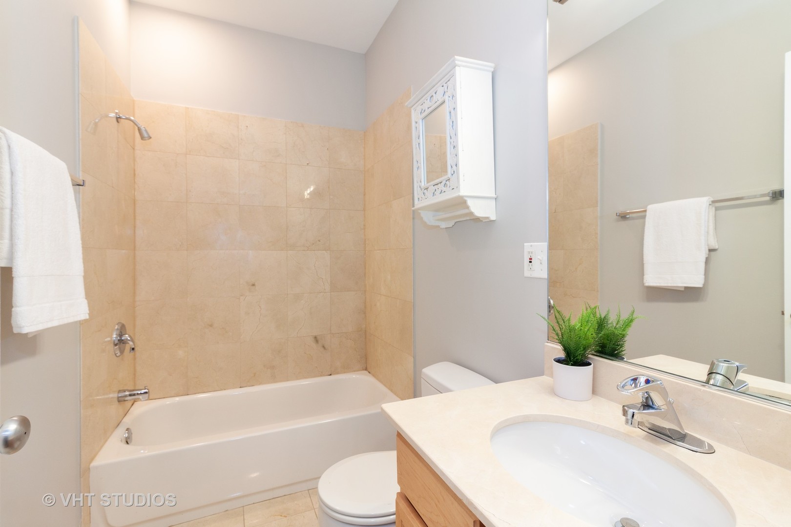 1345 West Fillmore Street, Unit 1 Chicago, IL 60607 - Photo 19 of 26 a bathroom with a sink toilet and shower