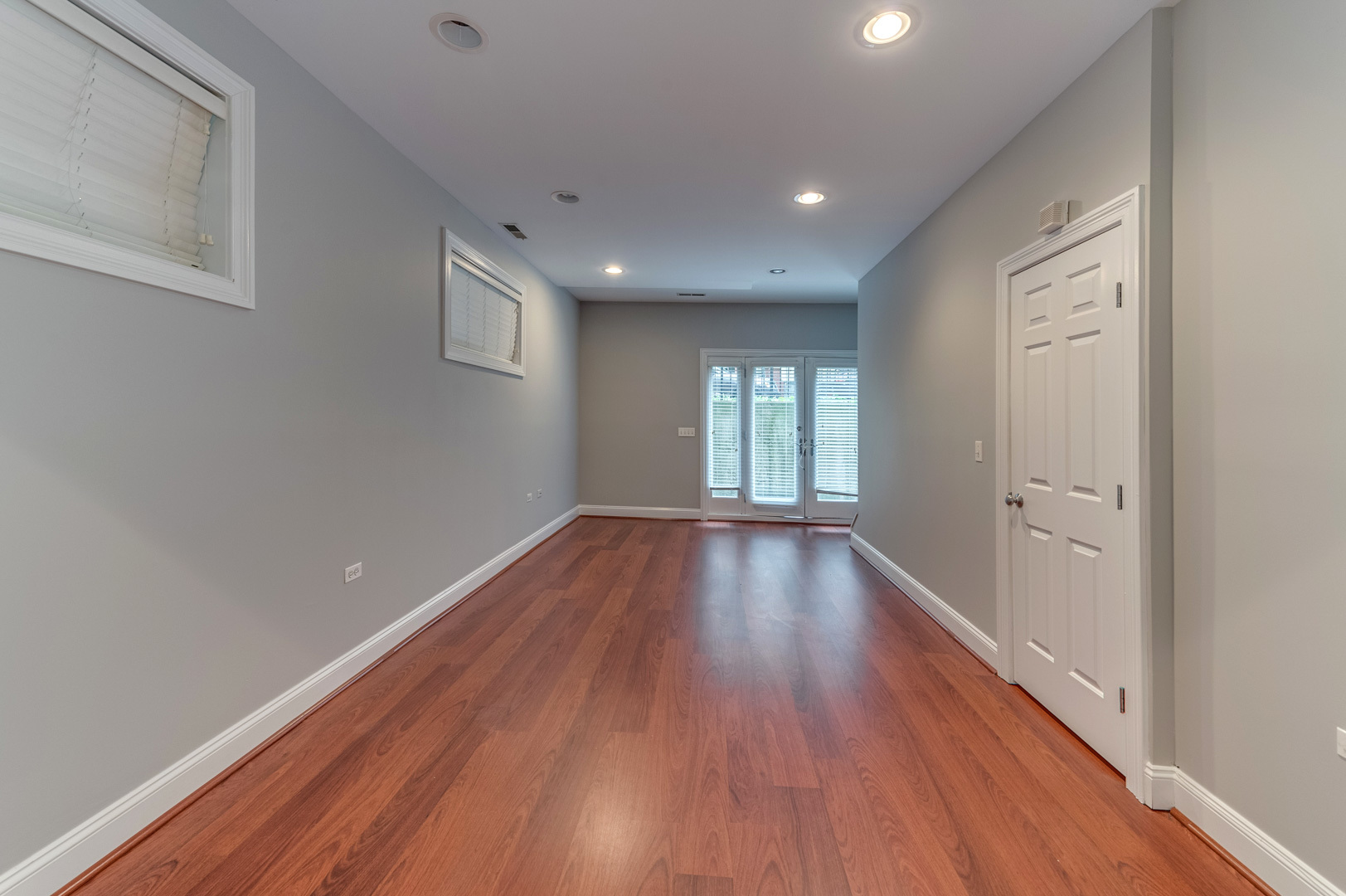 1345 West Fillmore Street, Unit 1 Chicago, IL 60607 - Photo 20 of 26 a view of an empty room with wooden floor and windows