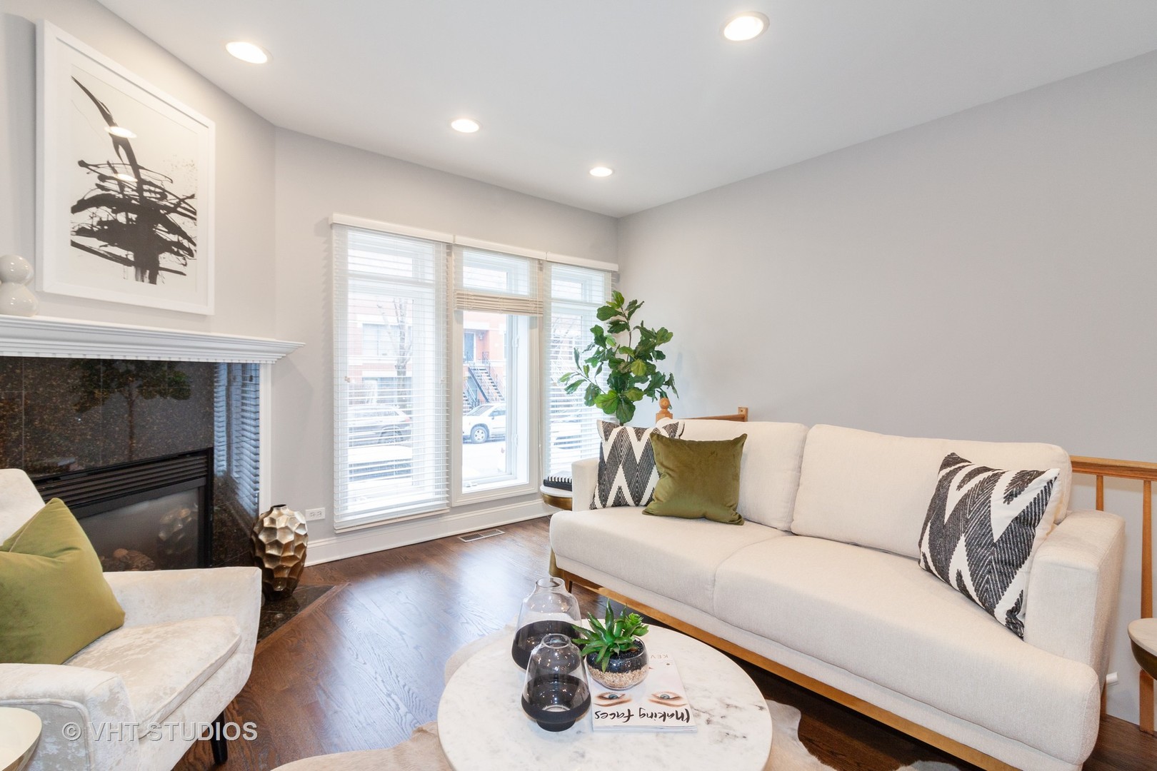 1345 West Fillmore Street, Unit 1 Chicago, IL 60607 - Photo 4 of 26 a living room with furniture and a fireplace