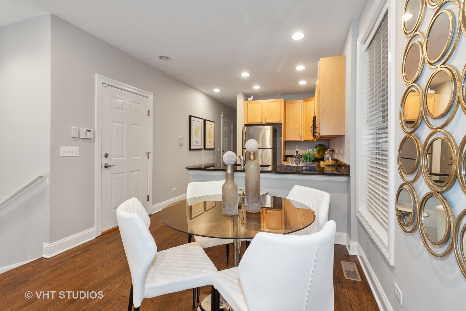 1345 West Fillmore Street, Unit 1 Chicago, IL 60607 - Photo 8 of 26 a dining room with furniture and a floor to ceiling window