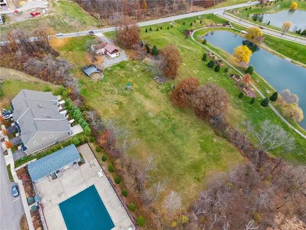 an aerial view of house with yard