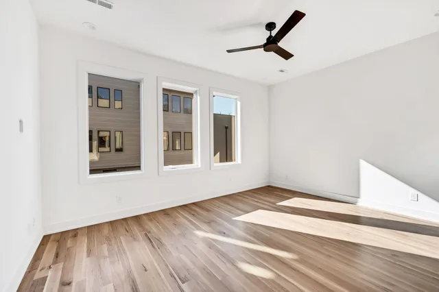 a kitchen with stainless steel appliances kitchen island a stove and a refrigerator