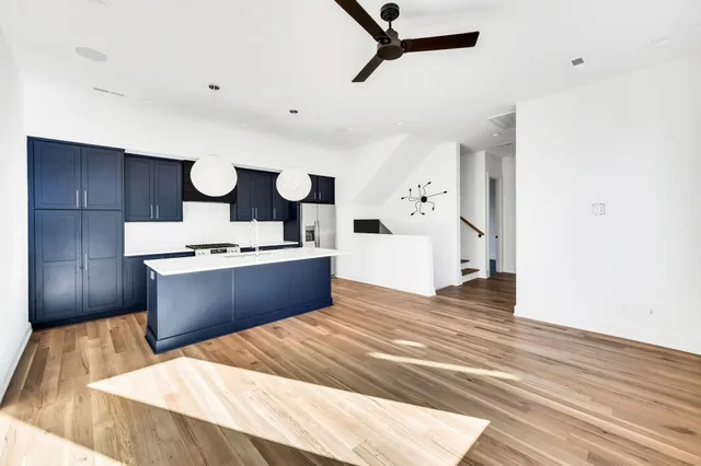 a refrigerator freezer sitting inside of a kitchen