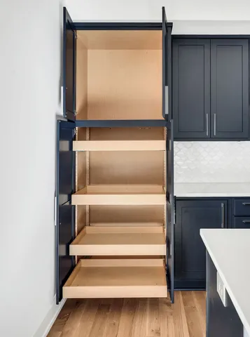 a kitchen with a sink and a stove top oven