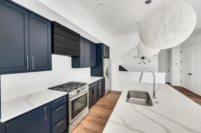 a view of a room with wooden floor and windows