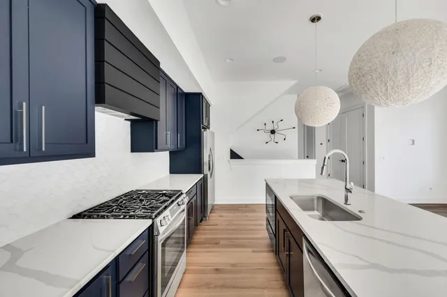a view of an empty room with closet and a window