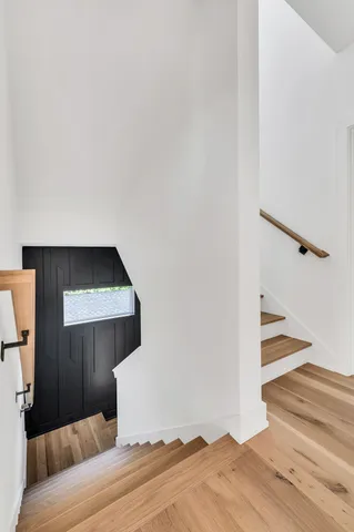 a view of a room with wooden floor