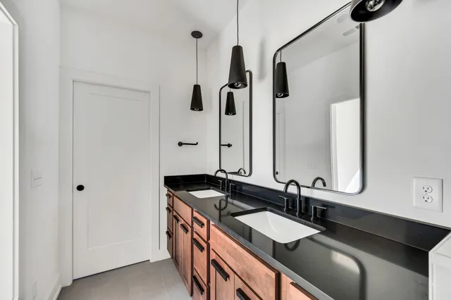 a multi story building with palm trees in front of it