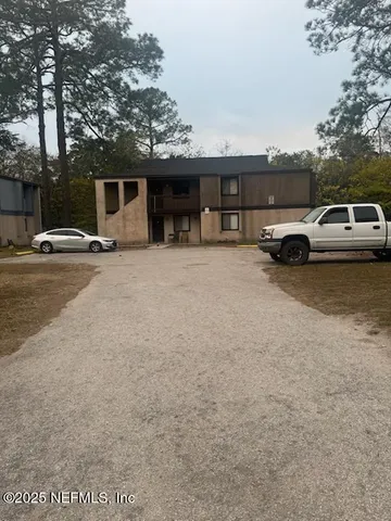 a view of a car parked in front of a house