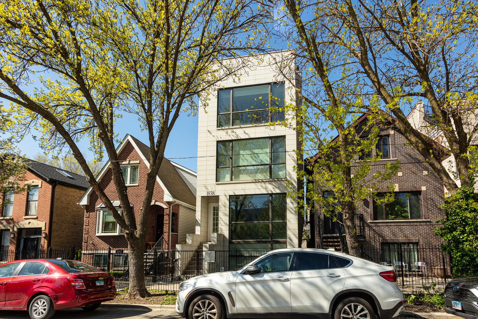 1838 West Rice Street, Unit 3 Chicago, IL 60622 - Photo 1 of 29 a front view of a building with parking area