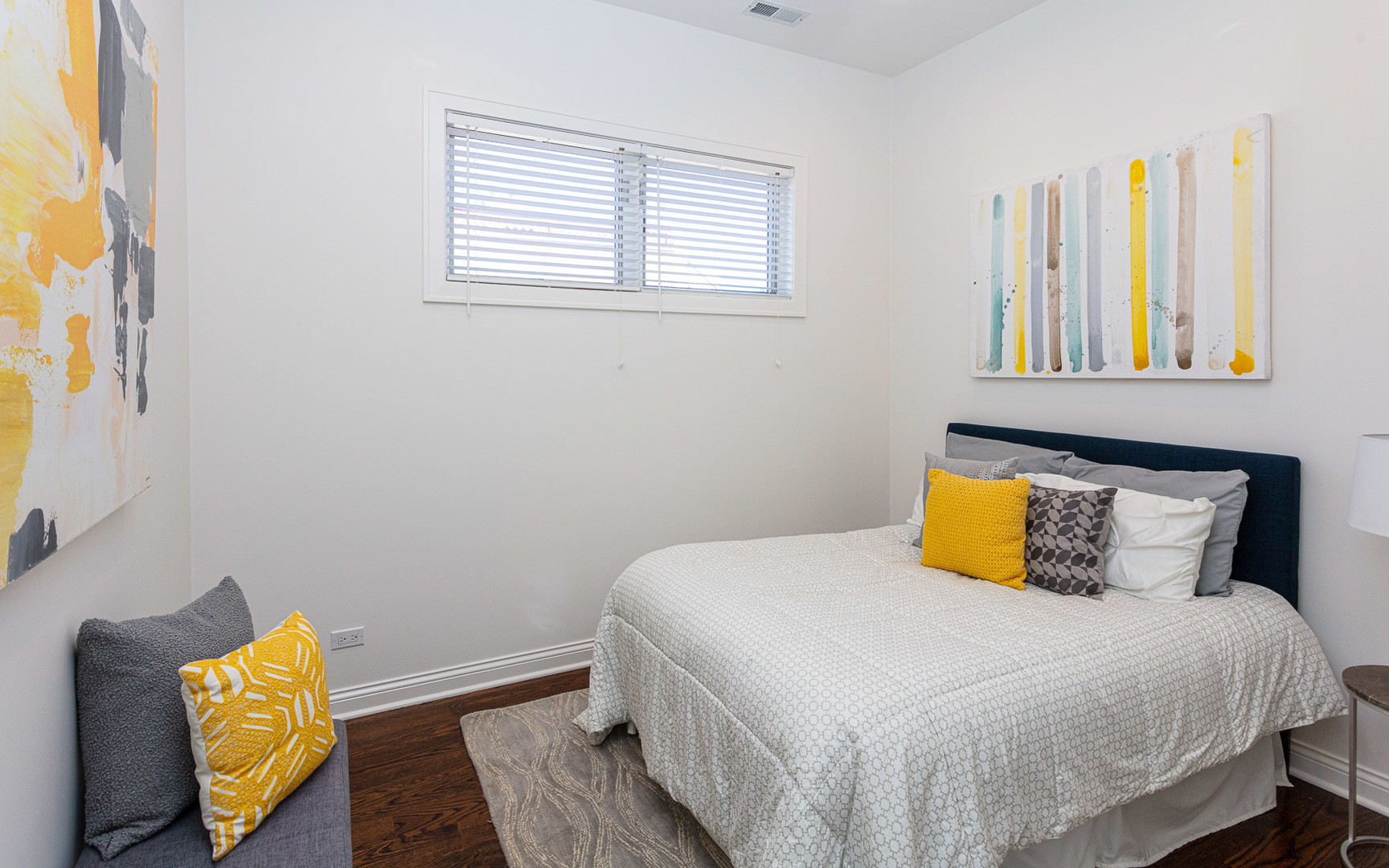 1838 West Rice Street, Unit 3 Chicago, IL 60622 - Photo 14 of 29 a bedroom with a bed and wooden floor