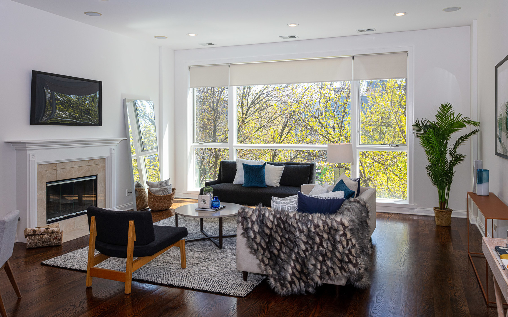 1838 West Rice Street, Unit 3 Chicago, IL 60622 - Photo 2 of 29 a living room with furniture large window and a fireplace