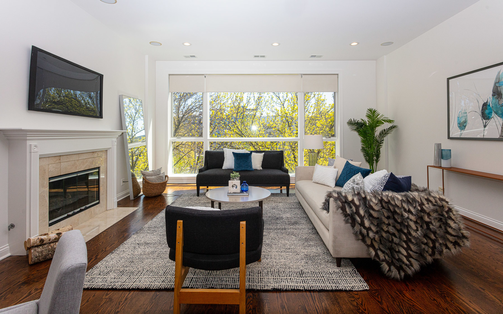 1838 West Rice Street, Unit 3 Chicago, IL 60622 - Photo 5 of 29 a living room with furniture a flat screen tv and a fireplace
