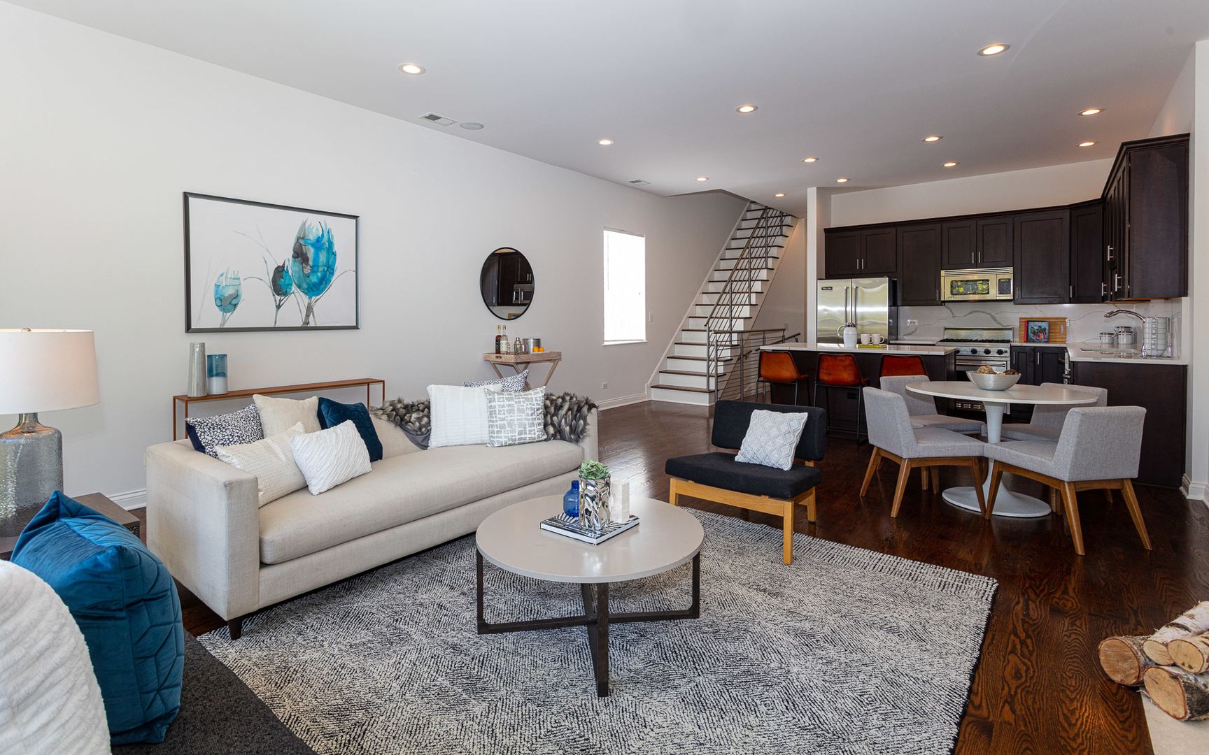 1838 West Rice Street, Unit 3 Chicago, IL 60622 - Photo 6 of 29 a living room with furniture kitchen view and a wooden floor