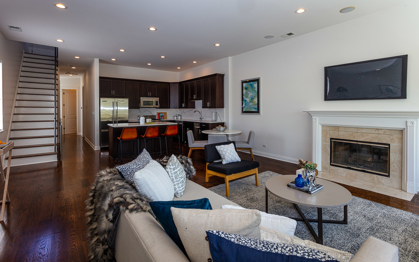 1838 West Rice Street, Unit 3 Chicago, IL 60622 - Photo 7 of 29 a living room with furniture a flat screen tv and kitchen view