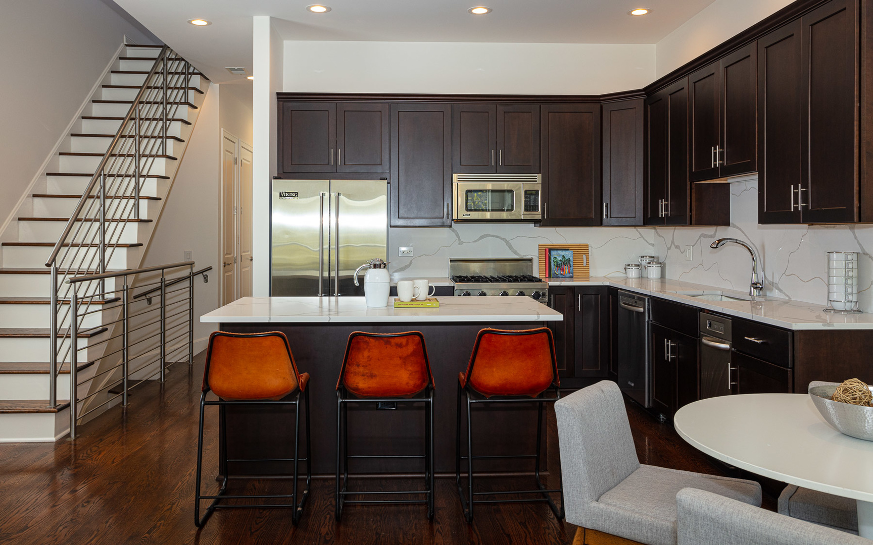 1838 West Rice Street, Unit 3 Chicago, IL 60622 - Photo 8 of 29 a kitchen with granite countertop a sink and cabinets